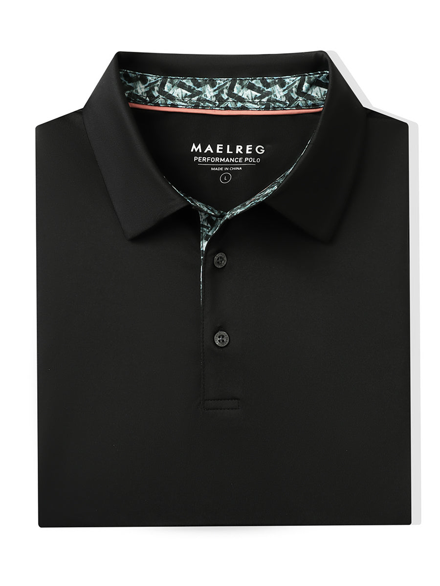 Folded Black Everyday Classic Solid Polo neatly laid out for display