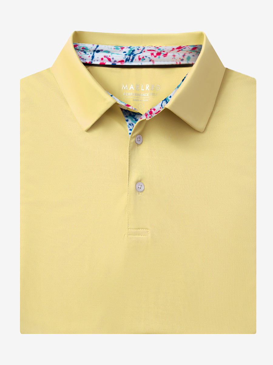 Folded Yellow Everyday Classic Solid Polo neatly laid out for display