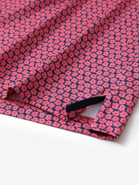 Hem slit detail of MAELREG Performance Jersey Print Polo in Rose Flower – comfort & movement