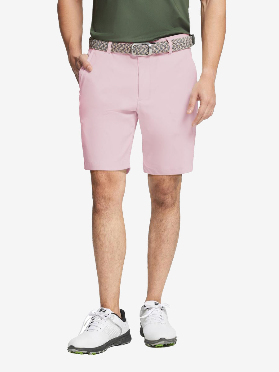 Pink water resistant golf shorts by MAELREG – model front-facing look