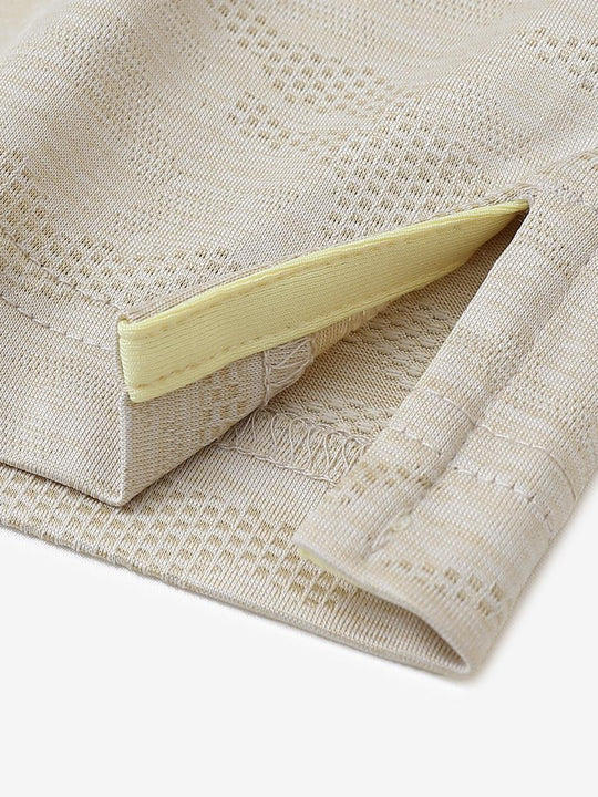 KHAKI HEATHER Camo Heather Jacquard Polo close-up of shirt hem slit detail