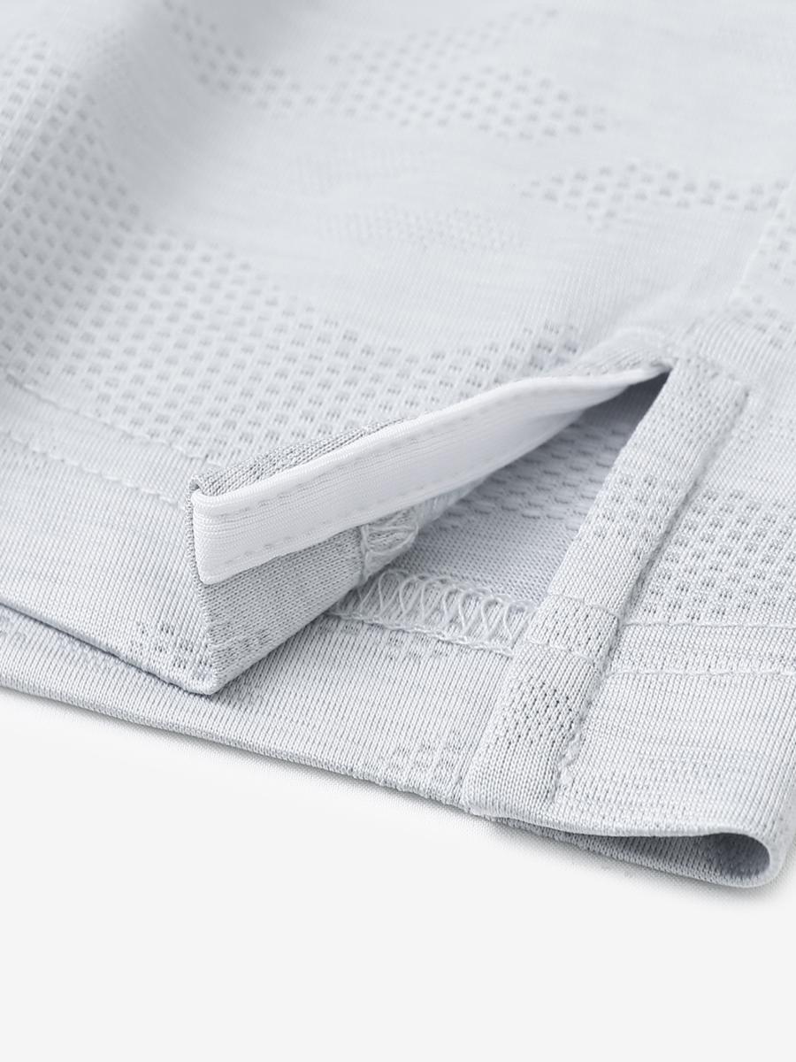 LIGHT GREY HEATHER Camo Heather Jacquard Polo close-up of shirt hem slit detail