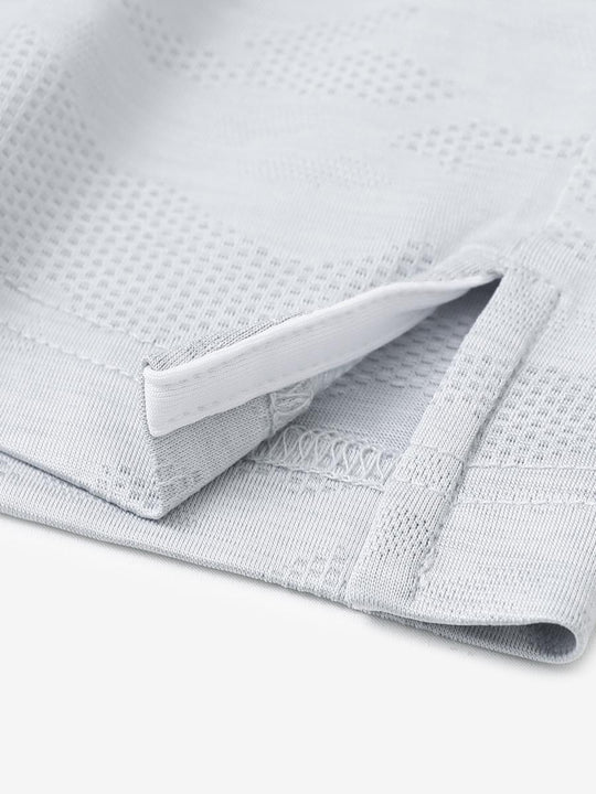 LIGHT GREY HEATHER Camo Heather Jacquard Polo close-up of shirt hem slit detail