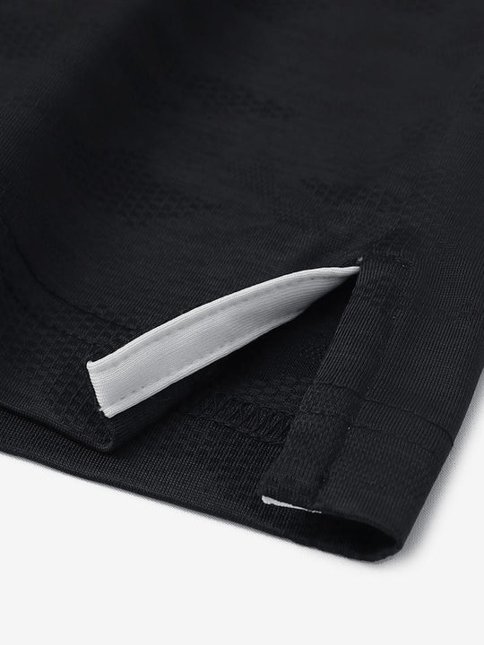 BLACK HEATHER Camo Heather Jacquard Polo close-up of shirt hem slit detail
