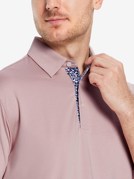 Male model wearing the Pale Pink Everyday Classic Solid Polo, front view from nose to chest