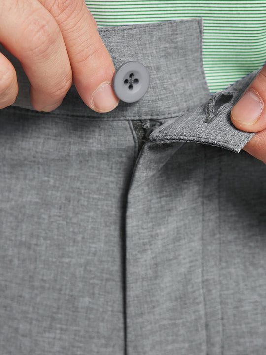 LIGHT GREY 9 Inch Heather Performance Golf Shorts close-up of waistband being stretched to show elasticity