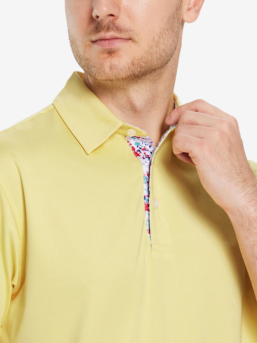 Male model wearing the Yellow Everyday Classic Solid Polo, front view from nose to chest