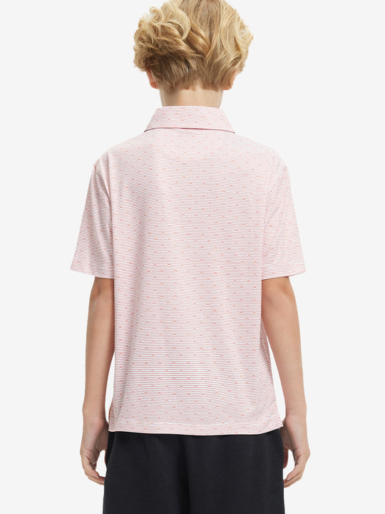 Back half-body view of boy wearing ORANGE SEA WAVE Performance Print Boys Golf Polo outdoors