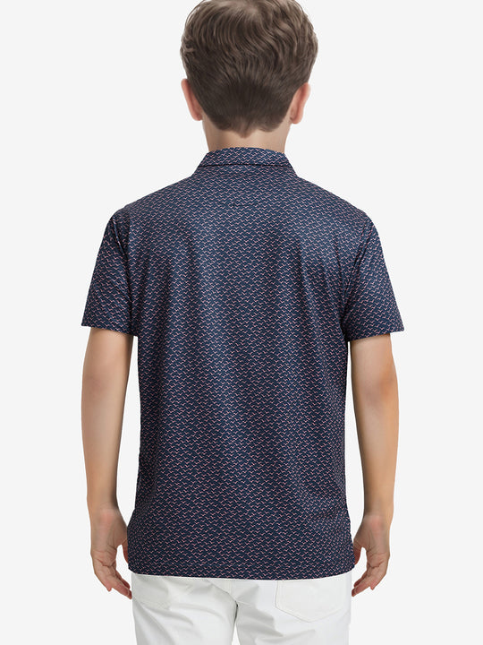 Back half-body view of boy wearing NAVY PINK SEAGULL Performance Print Boys Golf Polo outdoors