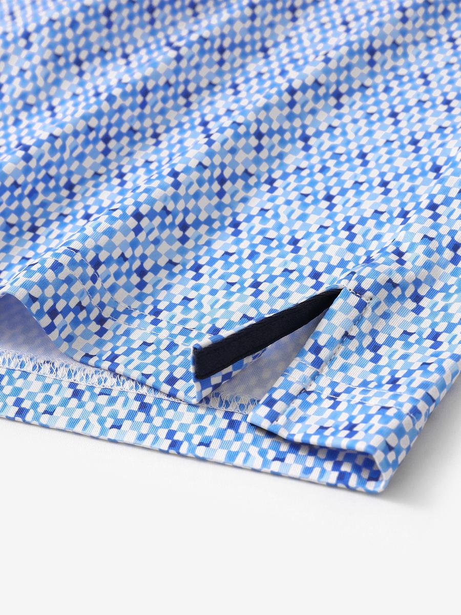Hem slit detail of MAELREG Performance Jersey Print Polo in Gingham Mosaic – comfort & movement