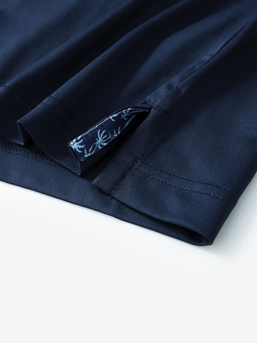 Close-up of side slit detail on the Navy Everyday Classic Solid Polo hem