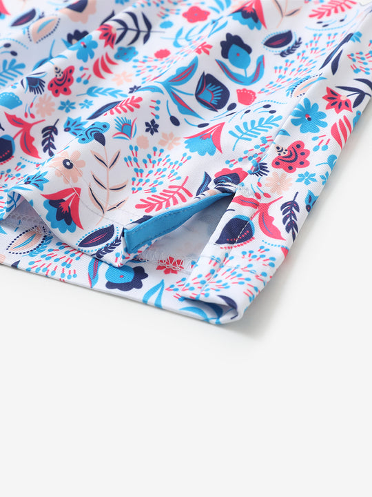 Detailed close-up of side hem slit on COLORFUL PLANTS Performance Print Boys Golf Polo for comfort