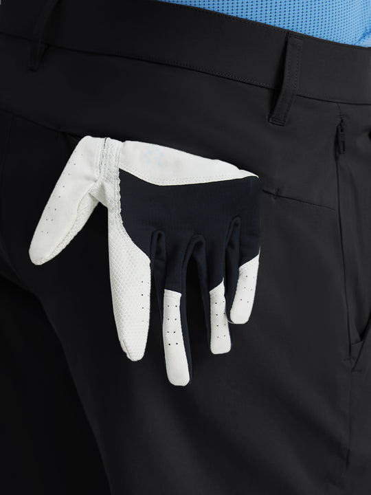 Close-up of right front pocket with zipper being opened on Player Fit Versatile Solid Shorts 9 Inch – BLACK