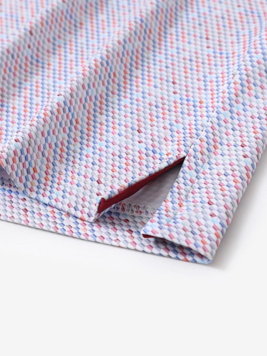 Hem slit detail of MAELREG Performance Jersey Print Polo in Colourful Hexagon – comfort & movement
