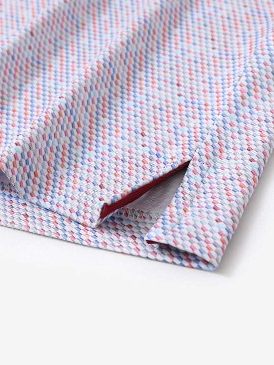 Hem slit detail of MAELREG Performance Jersey Print Polo in Colourful Hexagon – comfort & movement