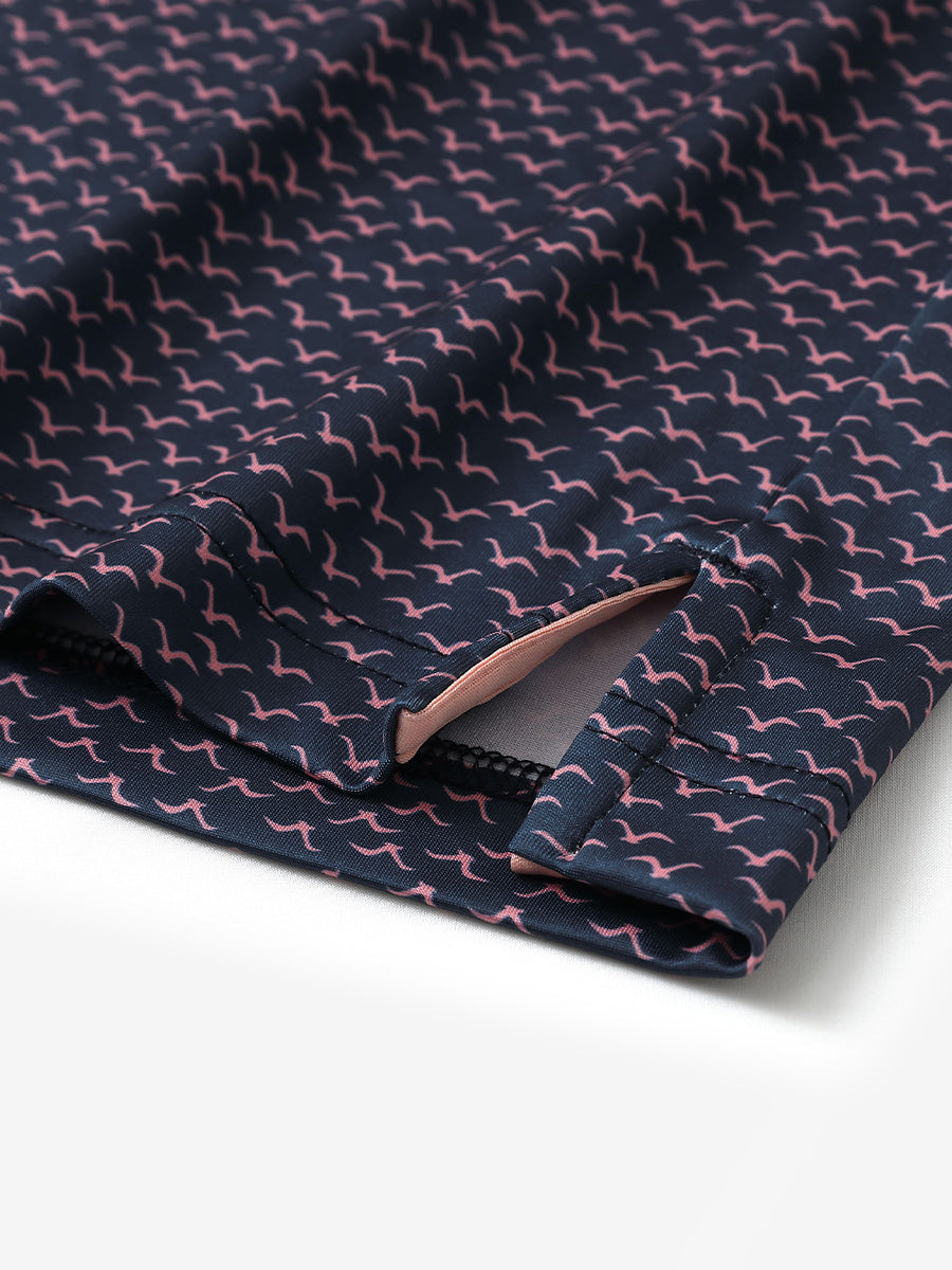 Hem slit detail of MAELREG Performance Jersey Print Polo in Navy Pink Seagull – comfort & movement