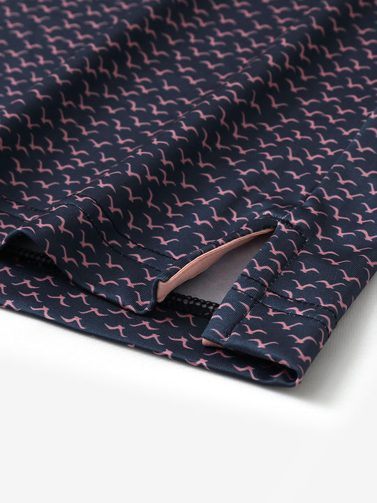 Hem slit detail of MAELREG Performance Jersey Print Polo in Navy Pink Seagull – comfort & movement