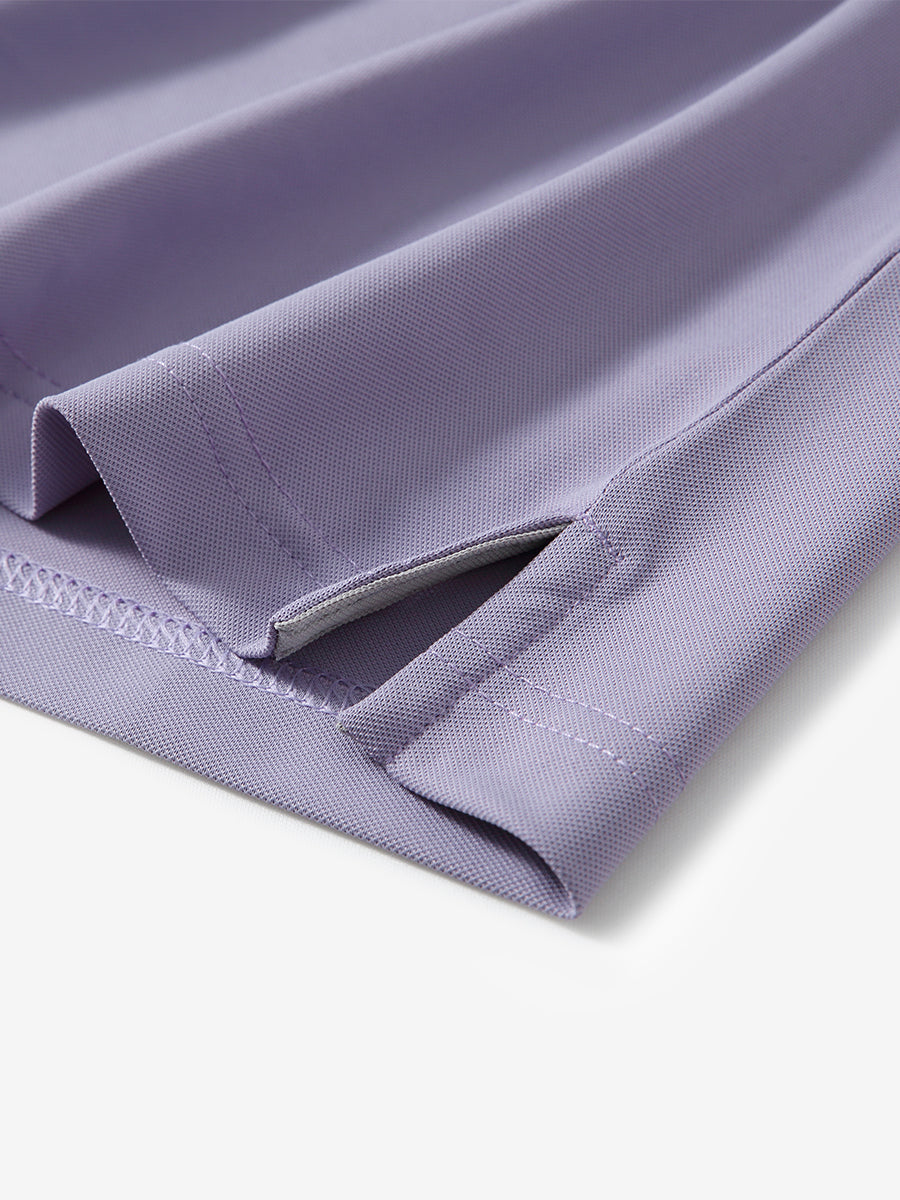 Detail shot of hem opening on LAVENDER Ventilated Pique Performance Polo