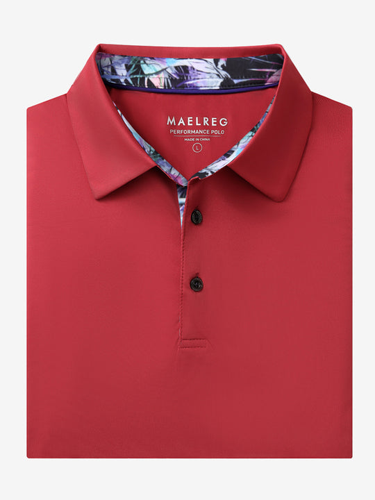 Folded Red Everyday Classic Solid Polo neatly laid out for display