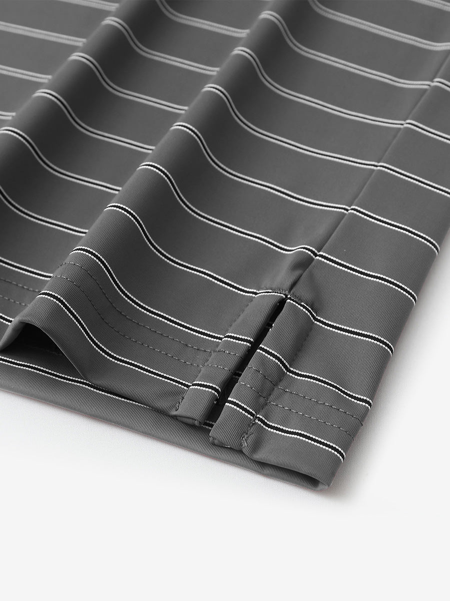 Close-up of side slit hem detail on DARK GREY STRIPE Water Resistant Stripe Nylon Polo