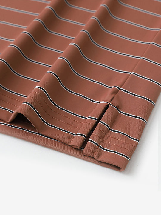 Close-up of side slit detail on Water Resistant Stripe Nylon Polo in Henna Stripe.