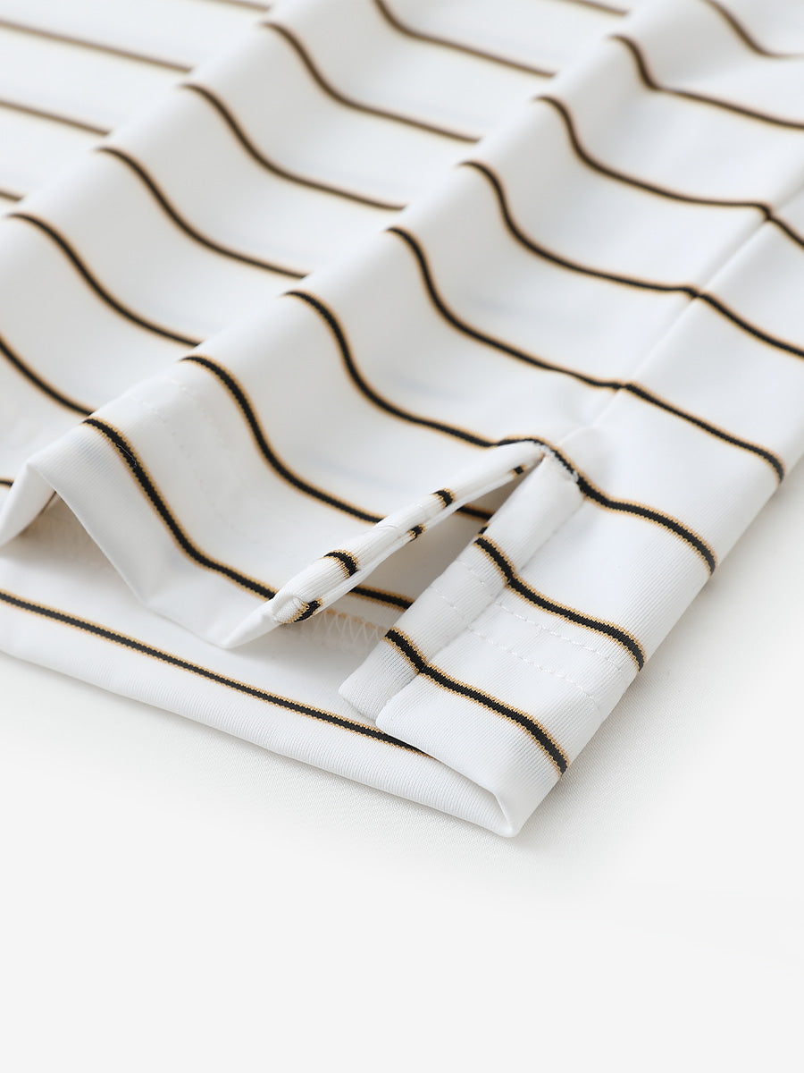 Close-up of side slit hem detail on CREAM STRIPE Water Resistant Stripe Nylon Polo