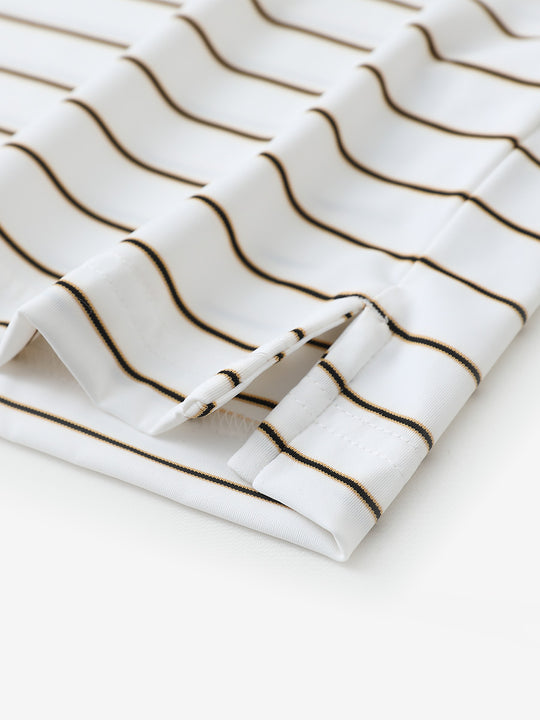Close-up of side slit hem detail on CREAM STRIPE Water Resistant Stripe Nylon Polo